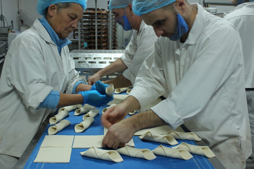 A group of people working in a factory.